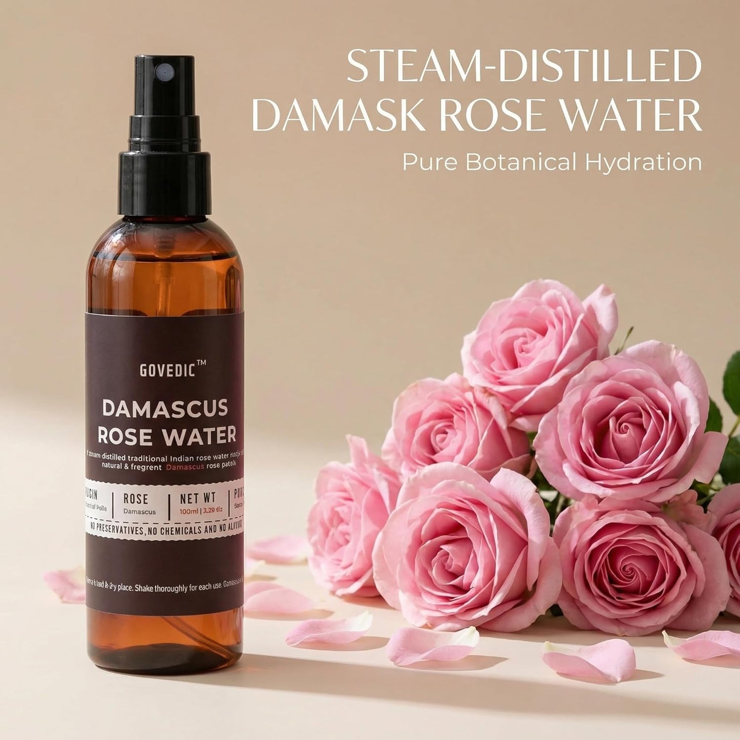 Bottle of Damascus Rose Water with pink roses on a beige background