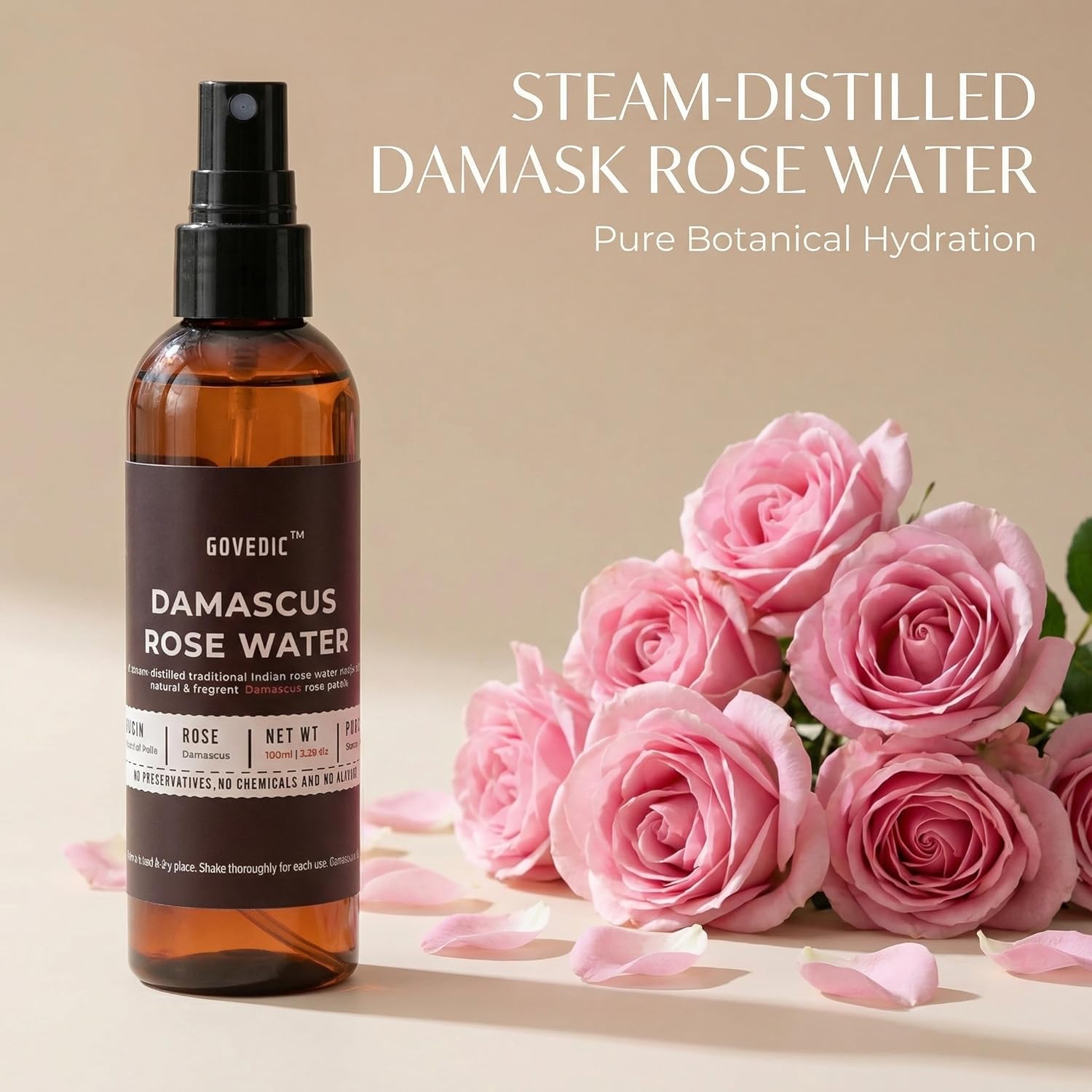 Bottle of Damascus Rose Water with pink roses on a beige background